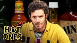 Adam Brody Surfs Through the Pain While Eating Spicy Wings